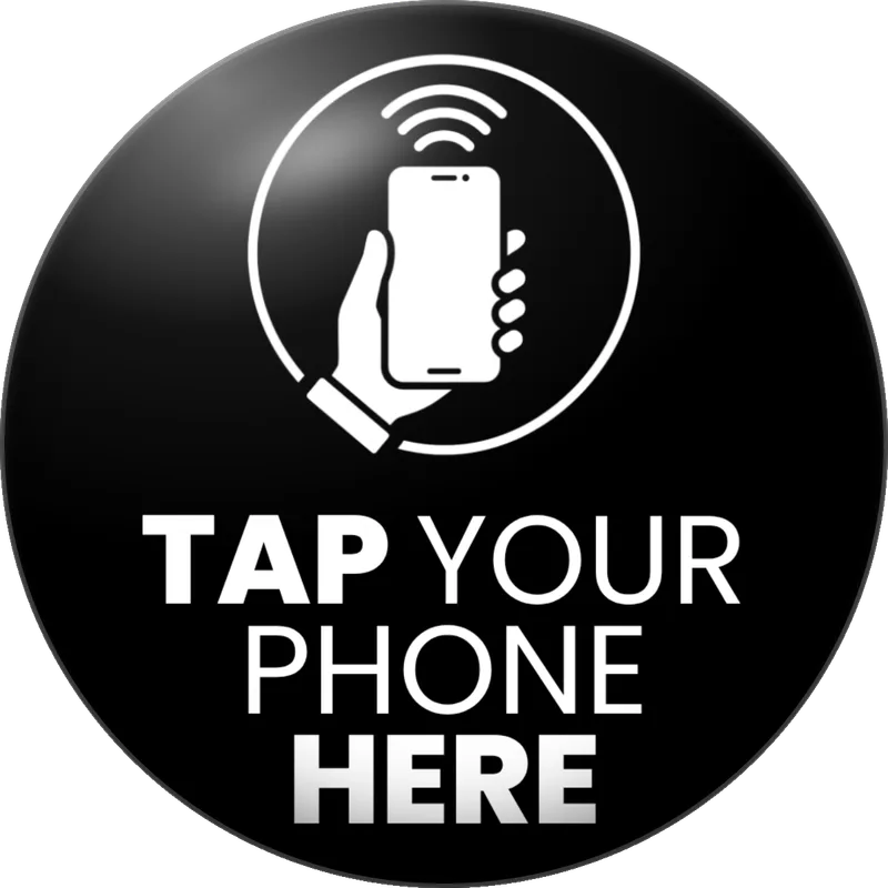 A round black KnowCore NFC check-in tag that reads “Tap your phone here”.